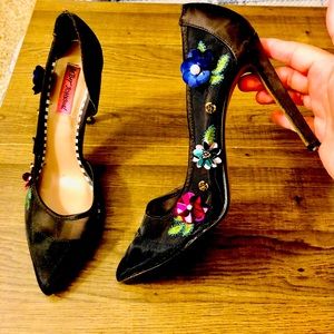 Gorgeous mesh and satin high heels with colorful flower decorations on the side.